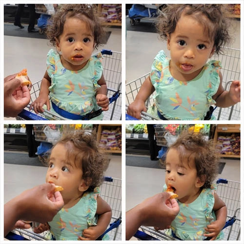 Picture of happy baby eating sauce